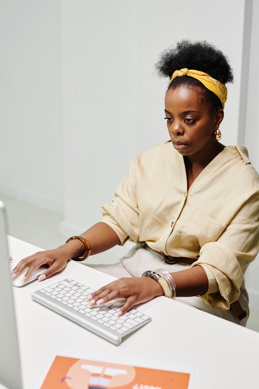 photo of a busy woman working on her computer